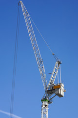 construction tower crane against blue sky