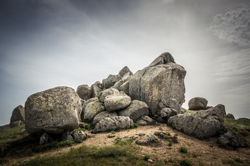 Rocks formations in Dobrogea, Tulcea county, Romania. Naturally formed piles of large rocks in Macin Mountain the olders alps in Europe - obrazy, fototapety, plakaty