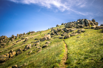 Rocks formations in Dobrogea, Tulcea county, Romania. Naturally formed piles of large rocks in Macin Mountain the olders alps in Europe