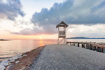 Old pier bridge in beautiful morning sunrise and calmness seascape