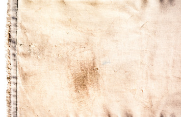 Texture of dirty brown fabric has the torn edge stitch on white background