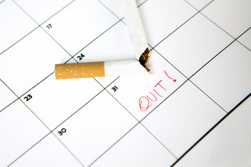 Broken cigarette on calendar