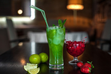 Selection of best selling drinks beer glass of wine cocktails martini mojito and shot short bar blurred background