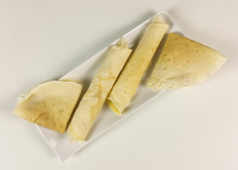 Crepes on white background - top view