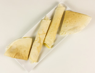 Crepes on white background - top view