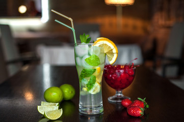 Selection of best selling drinks beer glass of wine cocktails martini mojito and shot short bar blurred background