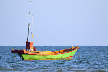 Fototapeta premium Image of small boat fishing on the sea.
