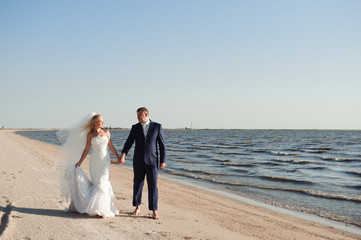 couple in love on the beach on their wedding day