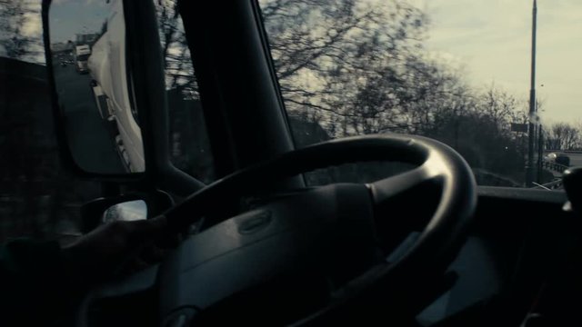 View in tank car's rearview mirror on highway