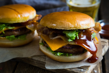 Hamburgers and beer on a wooden table