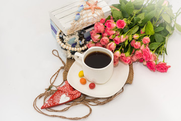 Pink roses coffee cup on decor background