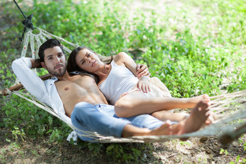 happy couple in love in hammock,selective focus