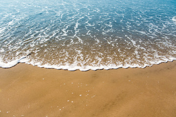 Soft wave of the sea on the sandy beach