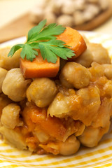 Bowl of chickpeas with wooden cutlery