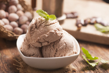 hazelnut ice cream on a wooden background close up