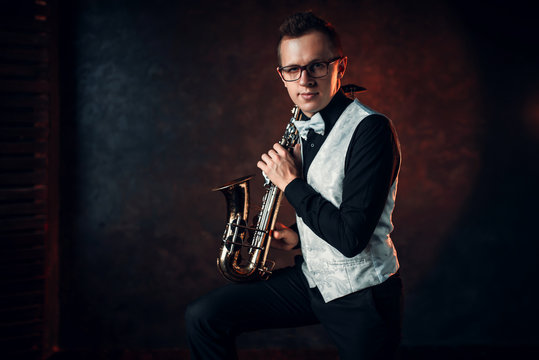 Male saxophonist playing classical jazz on sax