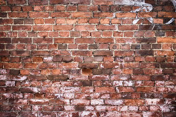 Old brick wall, old texture of red stone blocks closeup