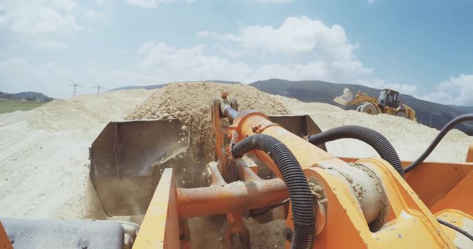 POV shot from a large construction loader working in a construction site