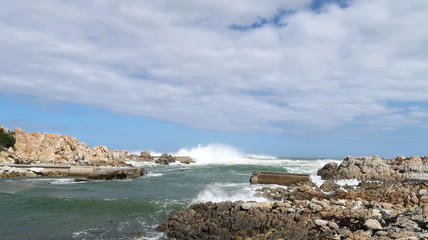 Waves Crashing On The Ocean Rocks