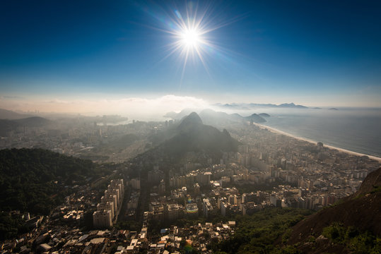 Aerial View of Copacabana District, the Sugarloaf Mountain in the Horizon, Sun Shines Above, Rio de Janeiro, Brazil