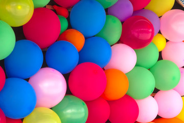 Fototapeta na wymiar many multicolored balloons wall full of colors