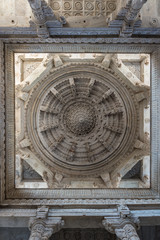 Interior of the majestic jainist temple at Ranakpur, Rajasthan, India. Architectural details of stone carvings.