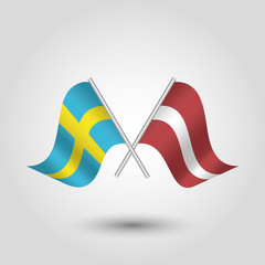 vector two crossed swedish and latvian flags on silver sticks - symbol of sweden and latvia