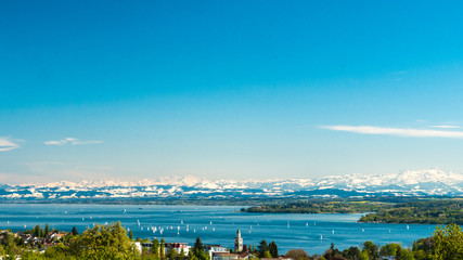 Fototapeta na wymiar Panoramic view of lake of Lake Constance with Apple Blossoms