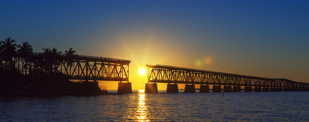 Fototapeta na wymiar colorful sunset with broken bridge