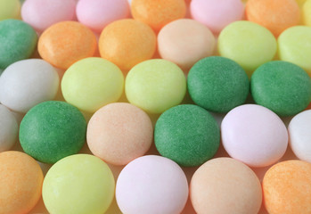 Fototapeta na wymiar Close-up of Pastel Colored Round Candies for Background, Banner, Texture 