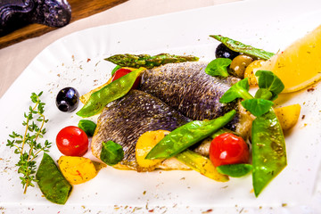 Fillet of Dorado fish baked with vegetables