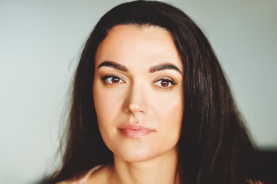 Close Up Portrait Of 35-40 Year Old Woman With Black Hair