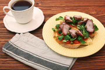 Open sandwich with pork greens and capers