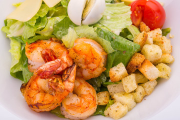 Tiger shrimps salad in sauce Caesar
