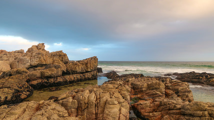 Rocks and Waves at the Beach at Dusk in South Africa