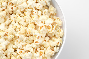 Popcorn in the bowl on white background - Soft focus