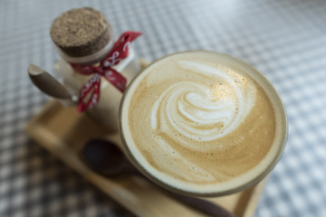hot coffee latte art with sugar