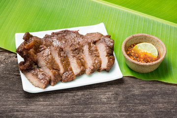 Thai Style fried beef in dish with spicy dip Sauce