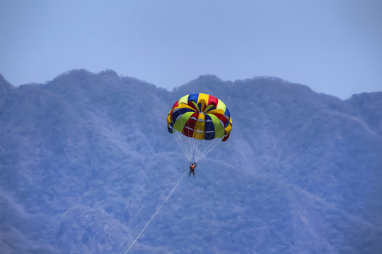 Parasailer against mountain backdrop