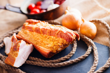 Smoked meat and vegetables in a vintage pan 