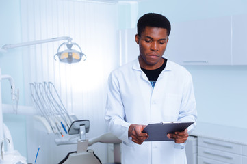 Black dentist in a dental clinic