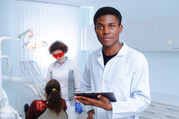 Fototapeta premium Black dentist in a dental clinic