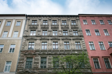 old building facade - apartment building exterior before restoration in Berlin