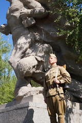 Fighter of Red Army in the form of times of World War II  at a historical monument (fragment)