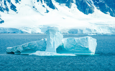 The shapes of icebergs drifting in Paradise Bay, Antarctica, are carved by the sea and winds. - 149427309