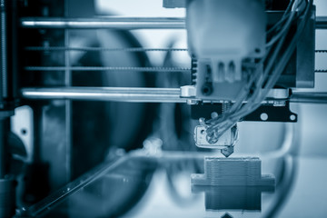 Electronic three dimensional plastic printer during work , 3D , printing.