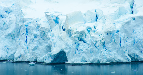 The blue and turquoise hues of the ice and snow along the shoreline of Antarctica are common sights with the coldest continent on Earth. - 149433757