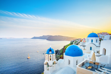 Fototapeta Classical view from sunset point at Oia village white and blue architecture, Santorini island, Greece. Incredible evening scenery. obraz