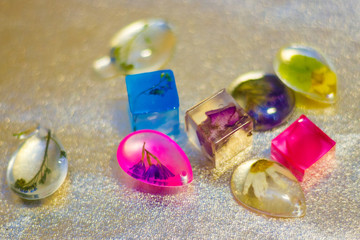 crystals made of epoxy resin with glitters and flowers