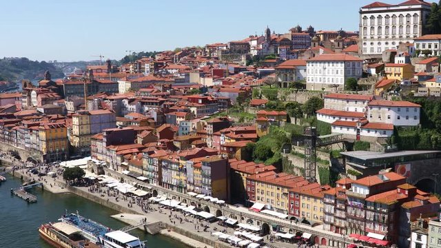 Panoramic view of old Porto city with Douro river at bright sunny day, Portugal. Video shot taken from the Dom Luis I bridge
